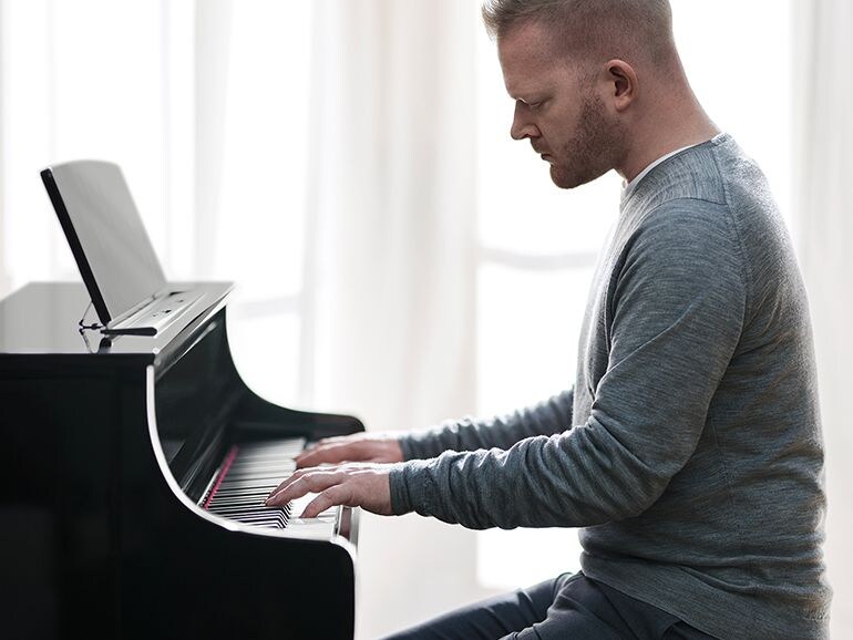 A person playing Yamaha Clavinova CLP-875PE