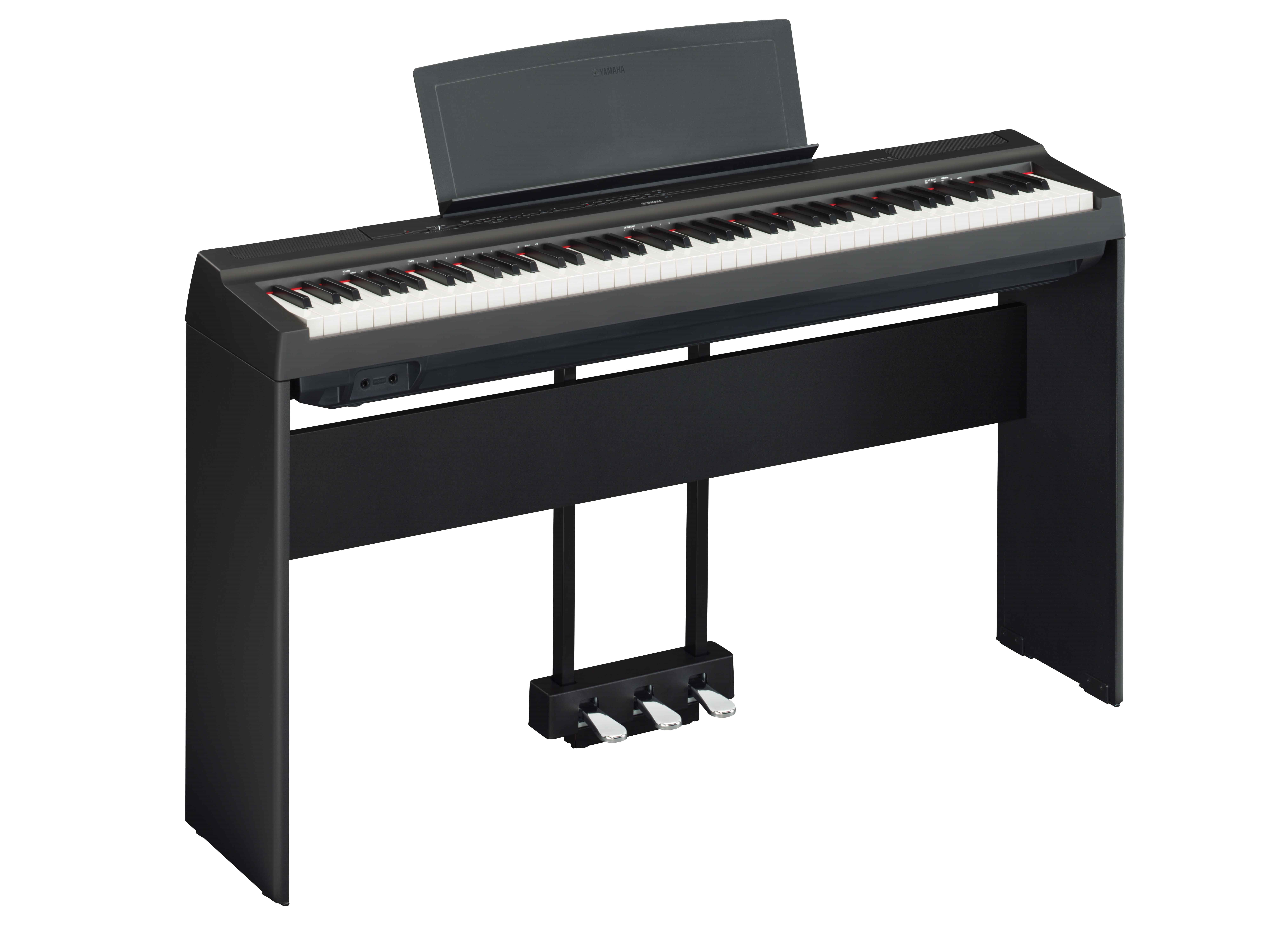 Black digital piano on stand with pedals and music stand.
