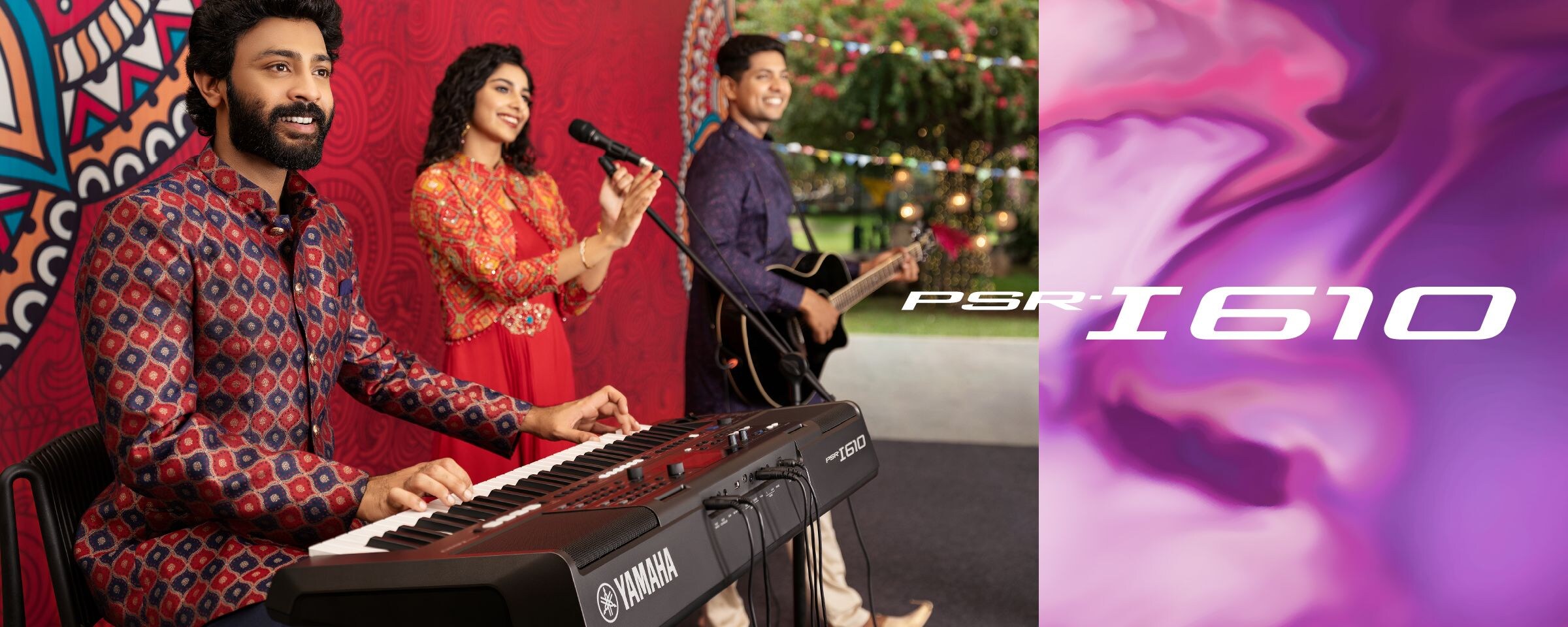 A vocalist, a guitarist, and a performer using the PSR-I610, play as a band outdoors