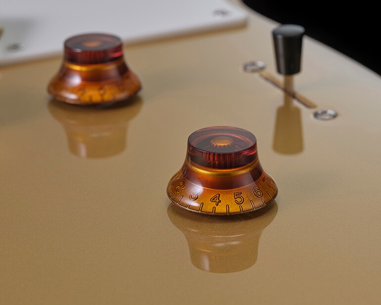 Gros plan sur le volume principal, la tonalité principale et le commutateur à levier à 3 positions