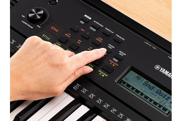 A person pushing the Quize mode button