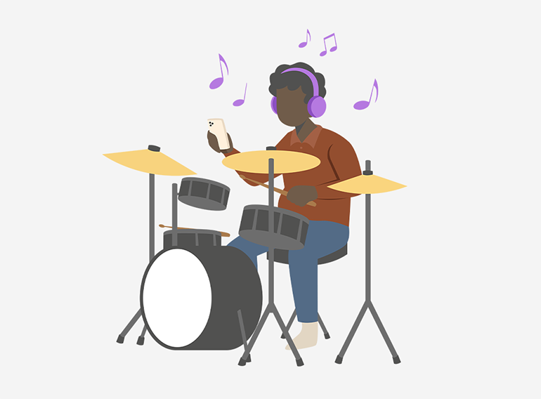 Un homme joue de la batterie en utilisant la fonction de séparation des pistes de l'application de pratique musicale Extrack